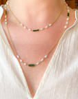 Gold necklace with pearl and green tourmaline accents