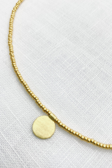The Makery, Short Gold Beaded Necklace with Brushed Gold Disc